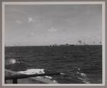 Japanese planes attacking the USS LEXINGTON (CV 16) during the Marshall Islands raid, as seen from the USS COWPENS (CVL 45).