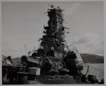 A 'hayseed' air added by its camouflage, the battered wreckage of the oft-bombed battleship HARUNA is one of the largest hulks in Kure Bay.