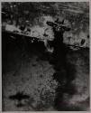 HIT BY NAVY BOMBS