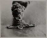 TORPEDOED TANKER SPURTS FLAME