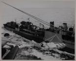 WOUNDED CAPTAIN COMES ABOARD CARRIER