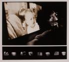 [Man with projection and TV screens]