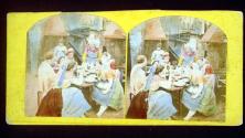 [People in costume around table]