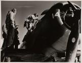 [Flight crew boarding airplane]