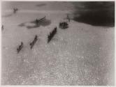 [Aerial view of canoes on water]
