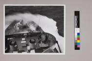 [Coast Guard ship being hit by a wave]