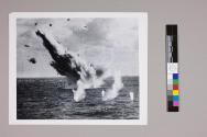 [A Japanese bomber airplane exploding into the Pacific Ocean]