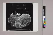 Information provided by radar's electronic eye is marked down on a vertical chart in the radar plot room of an ESSEX-class carrier during strikes against the Japanese earlier in 1945.