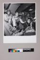 [A group of pilots surrounding Rear Admiral Calvin T. Durgin on the U.S.S. Tulagi]