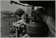 [Three Marine Corps officers on an aircraft carrier]