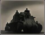 [Soldiers operating tank]
