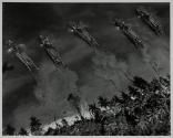 [Aerial view of troops going ashore]