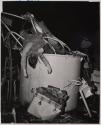 Battle Station - A twisted lifeless body of a Coast Guardsman who died at his battle station in combat.