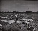 Scenes Shortly After D-Day, Mulberry. Germans and American dead waiting to be buried...Dog Red beach.