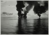 [Burning ships at sea]