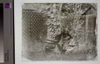 [Boy on Wheelbarrow]