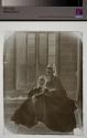 [Woman and Child on Porch Steps]