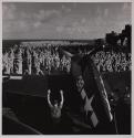 [Ship's company on deck of aircraft carrier for group exercises]