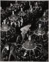 [Man on aircraft engine assembly line]