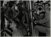 In control room of submarine during a diving operation