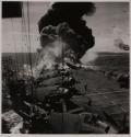 [Explosion on deck of aircraft carrier]