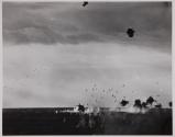 ["Jill" Attacks Carrier - Through a furious hail of AA fire, a Japanese torpedo bomber "Jill" flies toward a U.S. carrier to attack, during a task force raid on Truk, enemy-held bastion in the Carolines.]