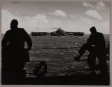 The camouflaged USS HORNET as seen from the deck of another carrier as the armada made its way toward the Marianas.