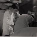 [Pvt. J.B. Slagle receives his daily dressing of wounds on board the U.S.S. Solace en route from Okinawa to Guam.]