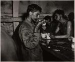 Coffee for Eniwetok Survivors - These Marines, begrimed and weary from two days and two nights of fighting, are typical of the conquerors of Eniwetok Atoll.