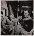[Soldiers singing and jesting]