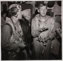 [Flight crew members  in conversation]