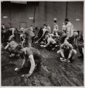 [Group mopping and scrubbing floor]