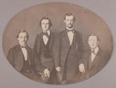 [Four men wearing ties and jackets]