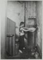 Tenement dweller. Community faucet in tenement hall, N.Y.