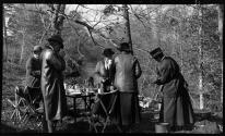 People around outdoor picnic table, Oak Lodge Trip