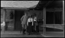 Friends posed in front of lodge, Oak Lodge Trip