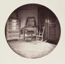 [Interior scene with vanity, dresser, and rocking chair]