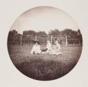 [Three children sitting on lawn]