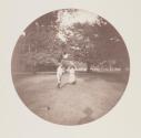 [Boy and girl on lawn]