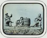 [Three figurines]