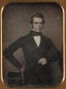 [Standing young man with top hat at hip]