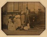 [Four women, two men and three children]