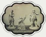 [Three figurines]