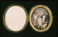 [Woman, child, and man]