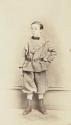[Young man with one hand on his hip]