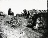 [Landscape with thatched cottages]