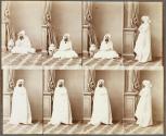 [Bearded man wearing white robe with hood]