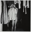 [Nude Eleanor hanging up clothes]