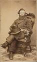 [Man holding top hat]