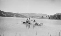 Camping companions fishing from raft, Wyoming Trip
